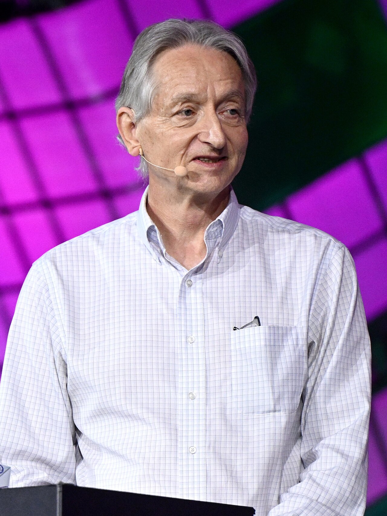 Geoffrey Hinton speaking onstage at the Collision technology conference in Toronto in June 2023.